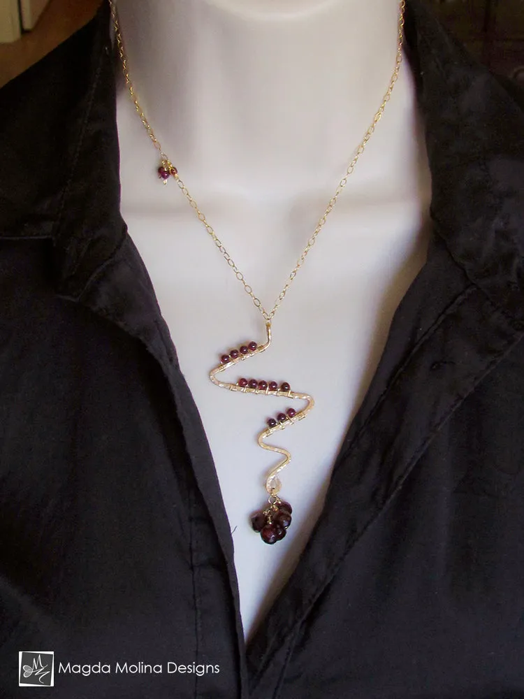 Gold Lightning Bolt And Garnet Necklace