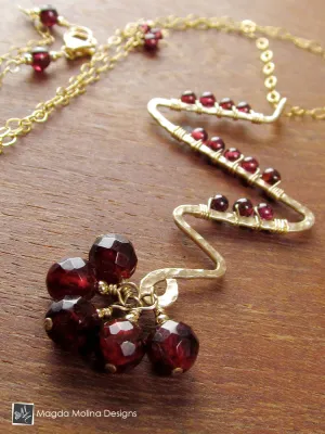 Gold Lightning Bolt And Garnet Necklace